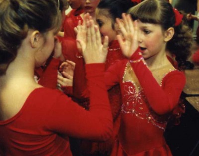Christina (8) (on right) and other skaters ready for their Pops on Ice performance, 1998.